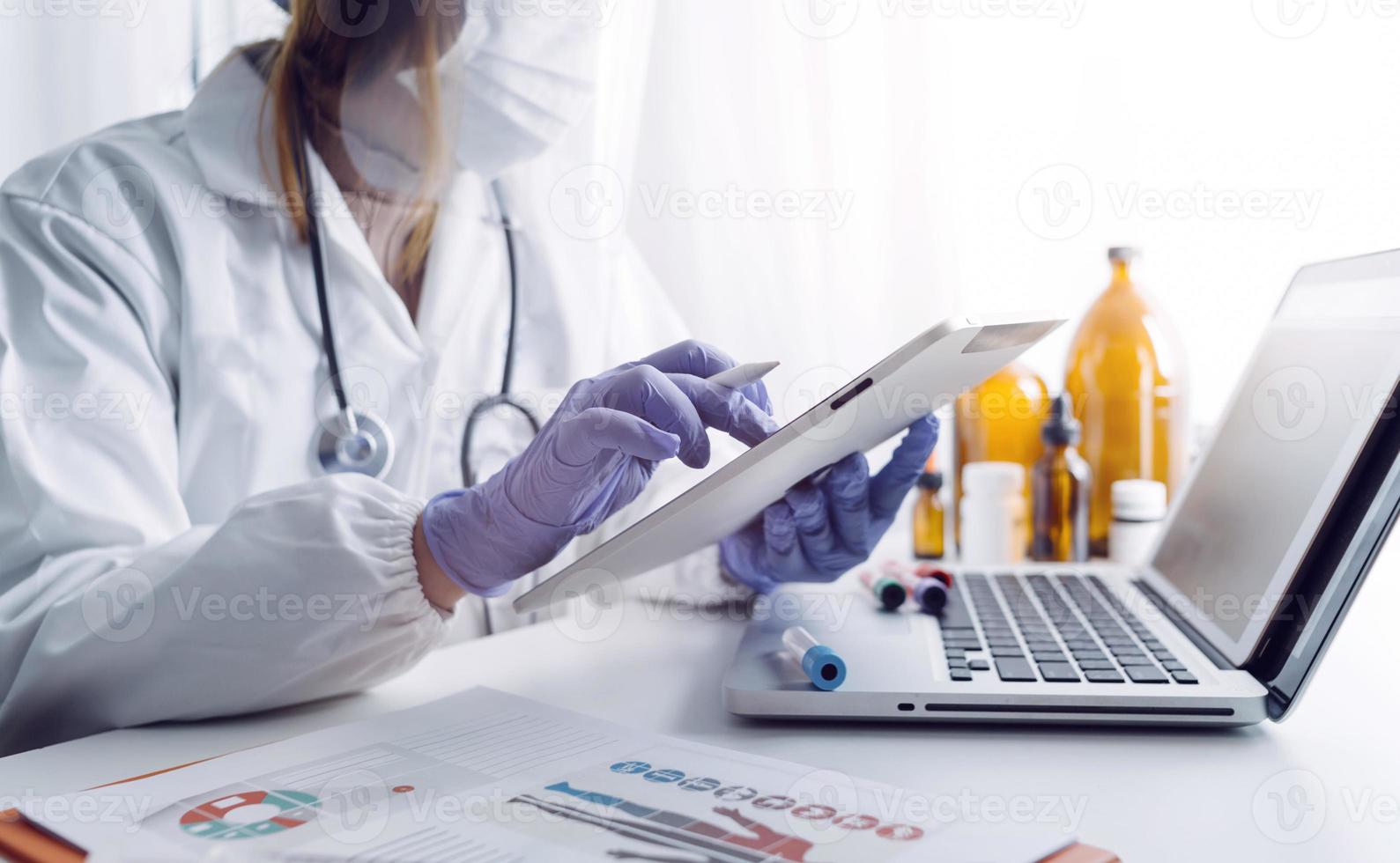 Medicine doctor and stethoscope touching icon medical network connection with modern interface on digital tablet in hospital background. Medical technology network concept photo
