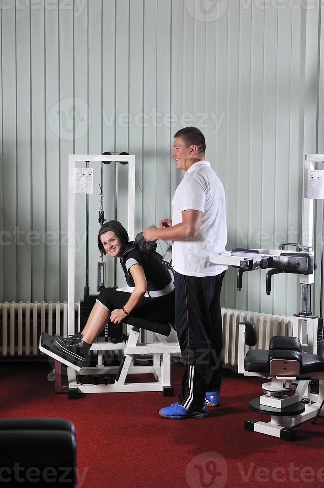 Young woman doing fitness in gym photo