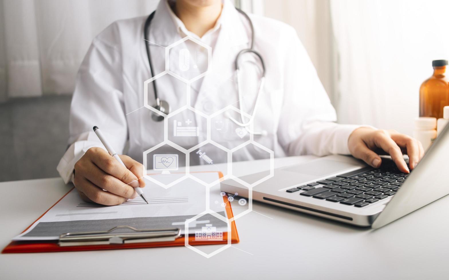 Medicine doctor and stethoscope touching icon medical network connection with modern interface on digital tablet in hospital background. Medical technology network concept photo
