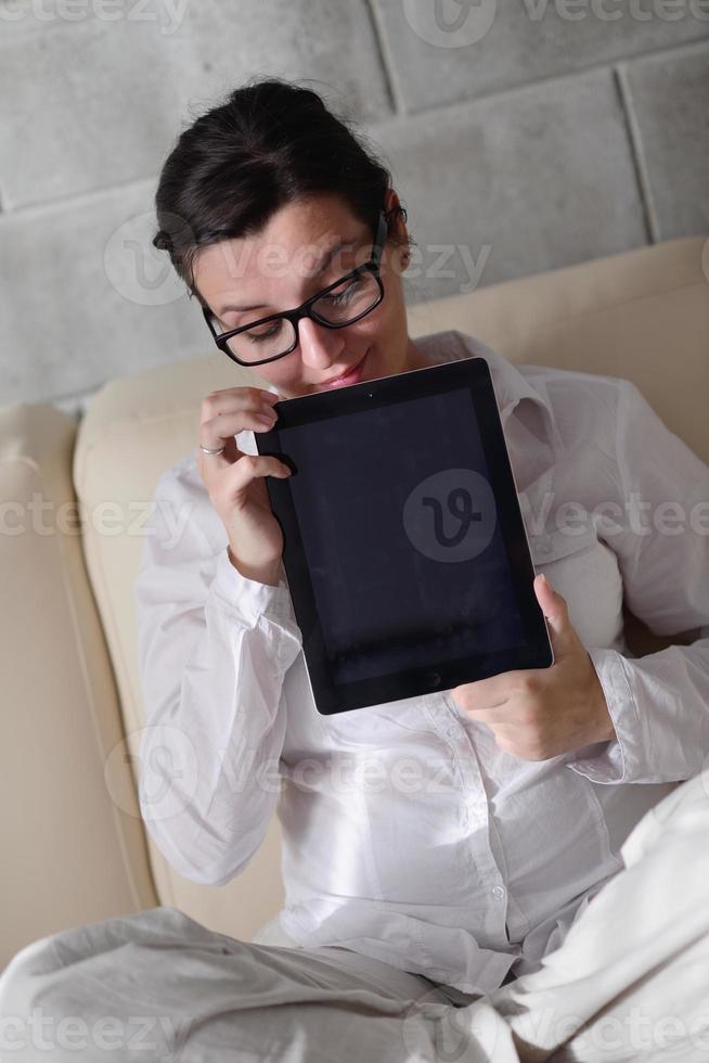 woman using tablet pc at home photo