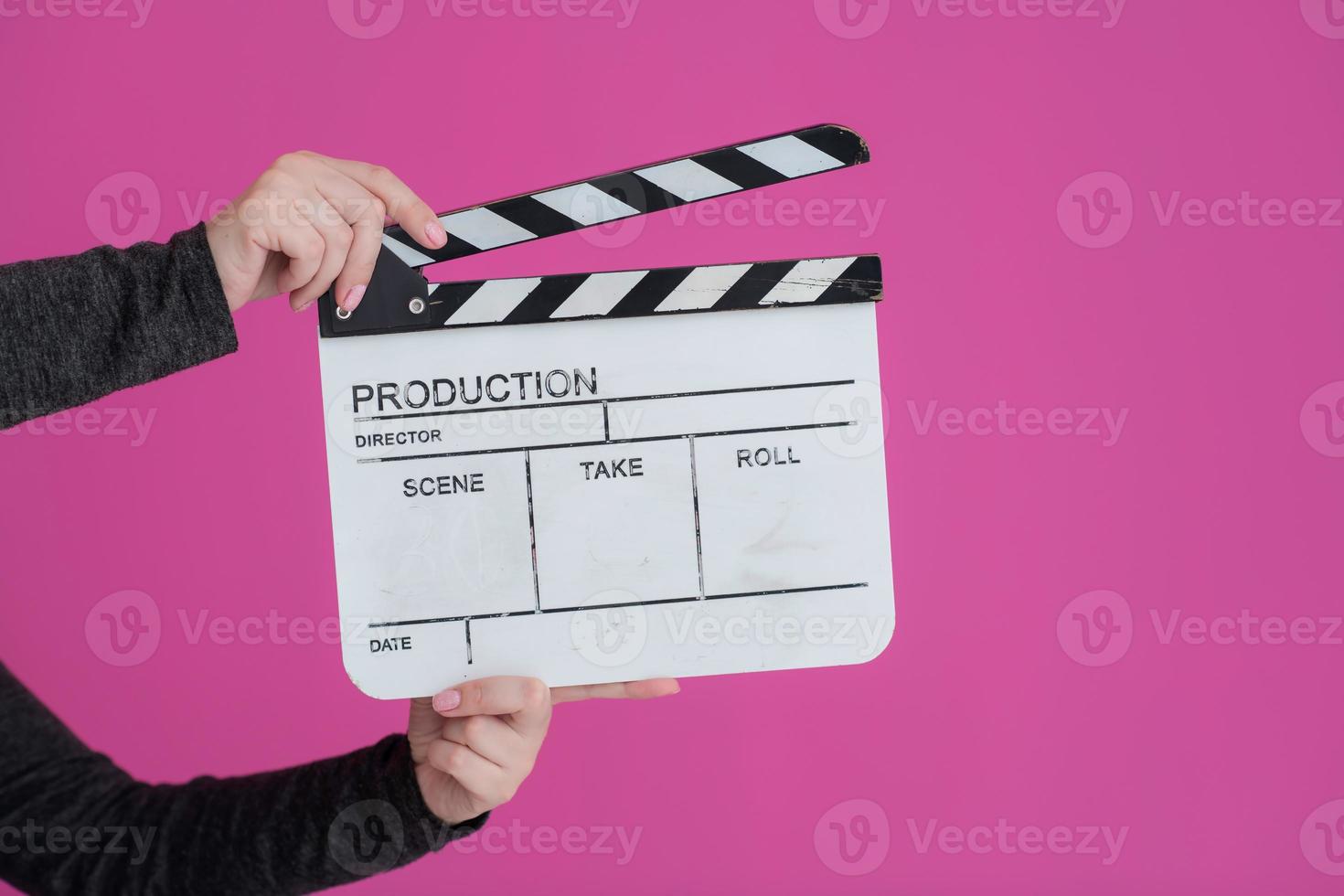 movie clapper on pink background photo