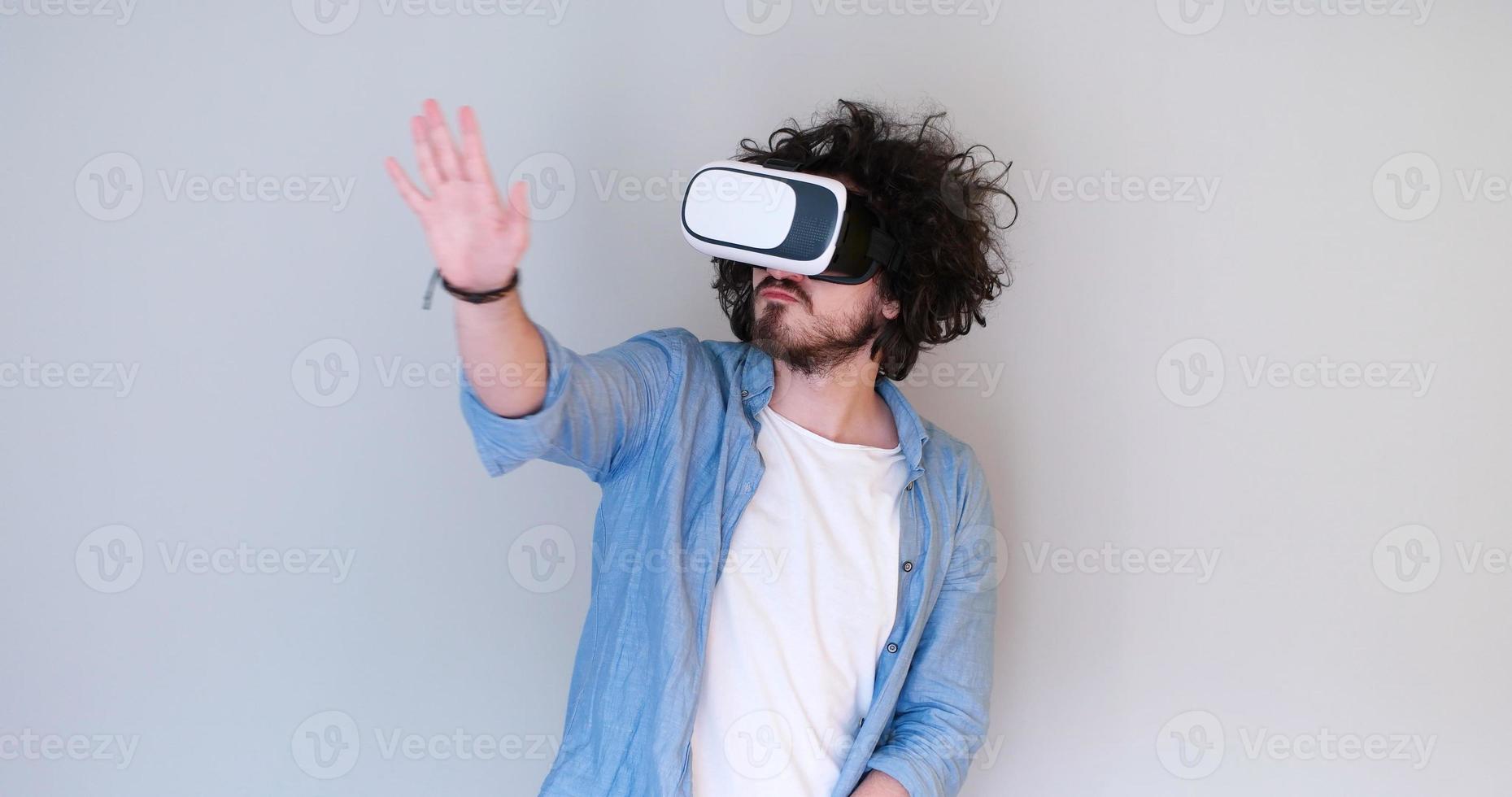 Man using headset of virtual reality photo