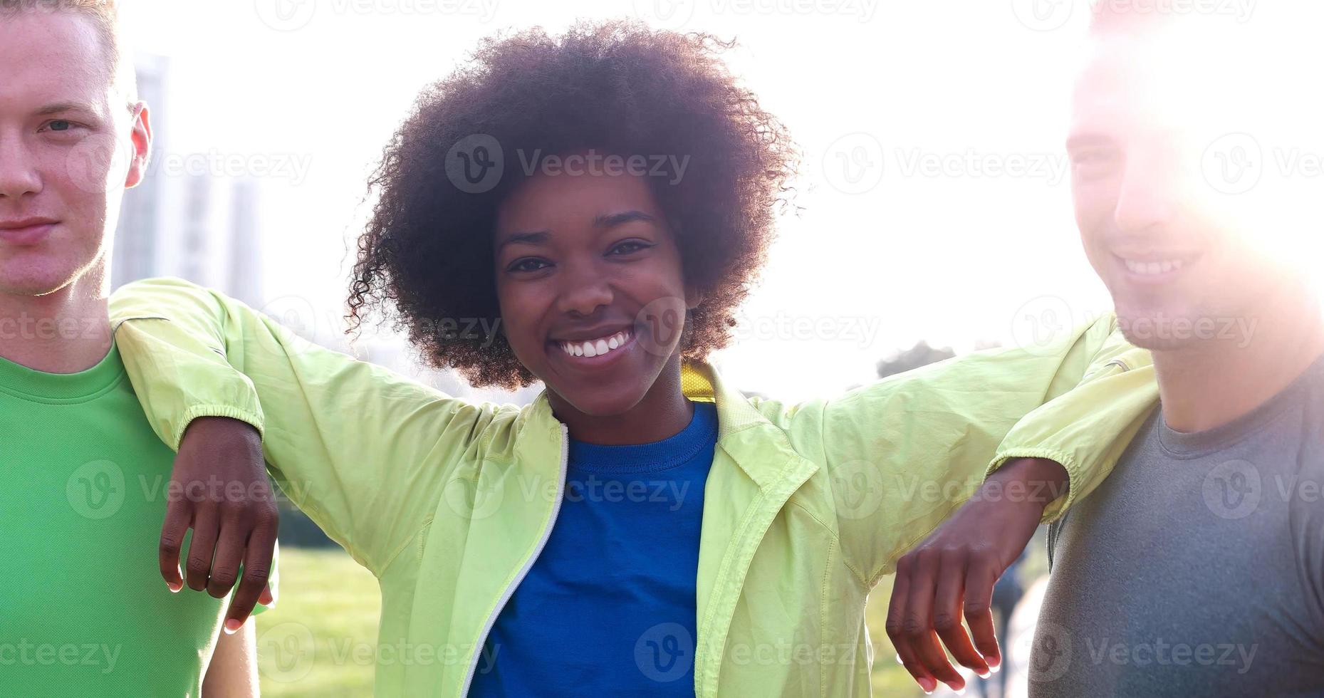 Portrait of multiethnic group of young people on the jogging photo