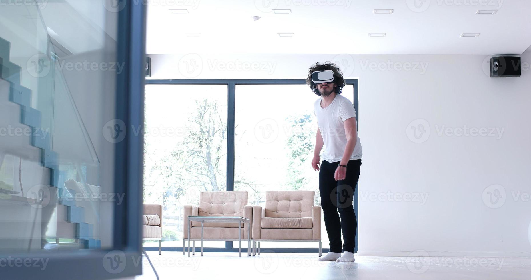 man using VR-headset glasses of virtual reality photo