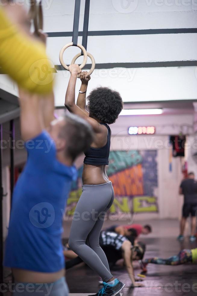 black woman doing dipping exercise photo