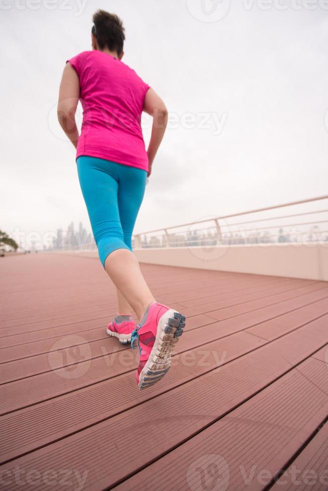 woman running on the promenade photo