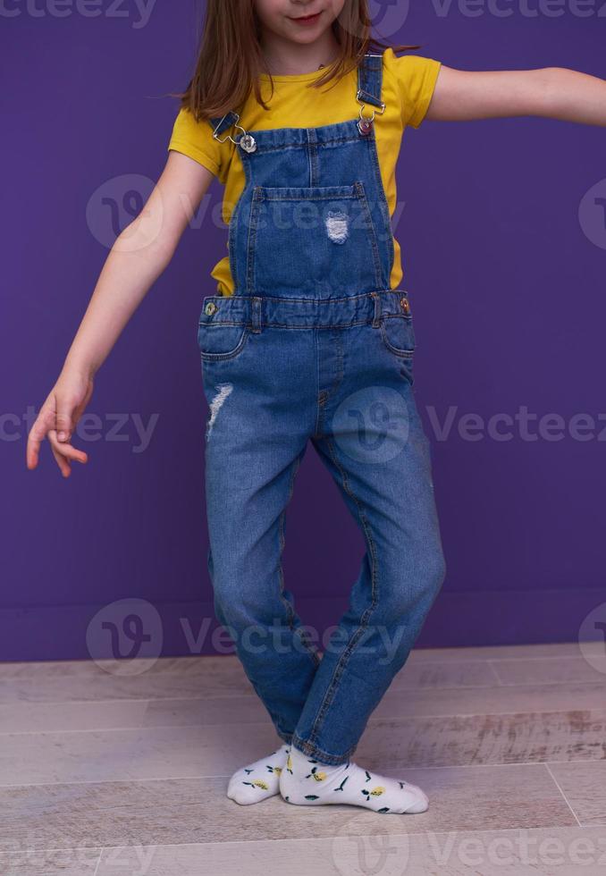 Cute little girl dancing at home photo