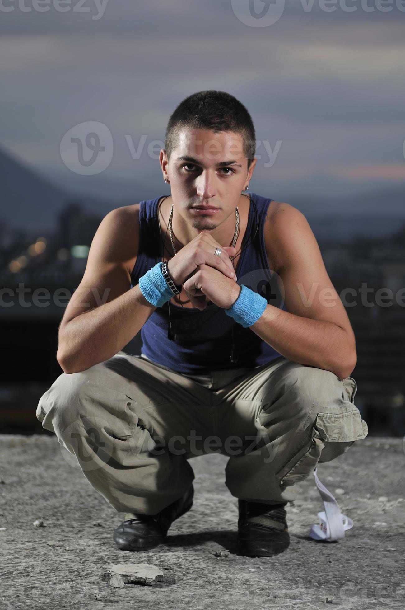urban style boy portrait in crouch pose 11320084 Stock Photo at Vecteezy