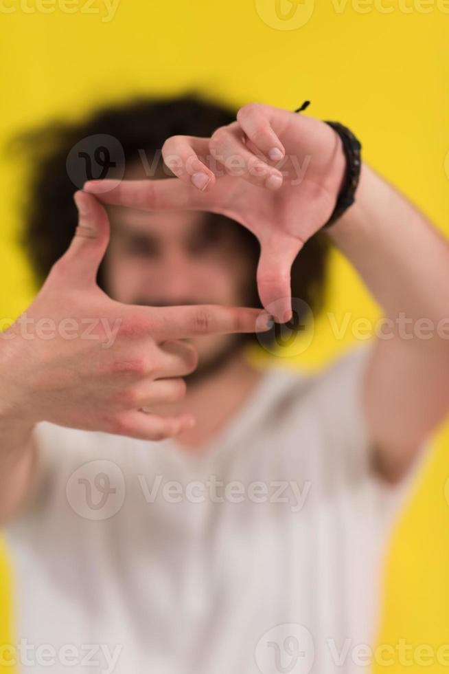 young man with funny hair over color background photo