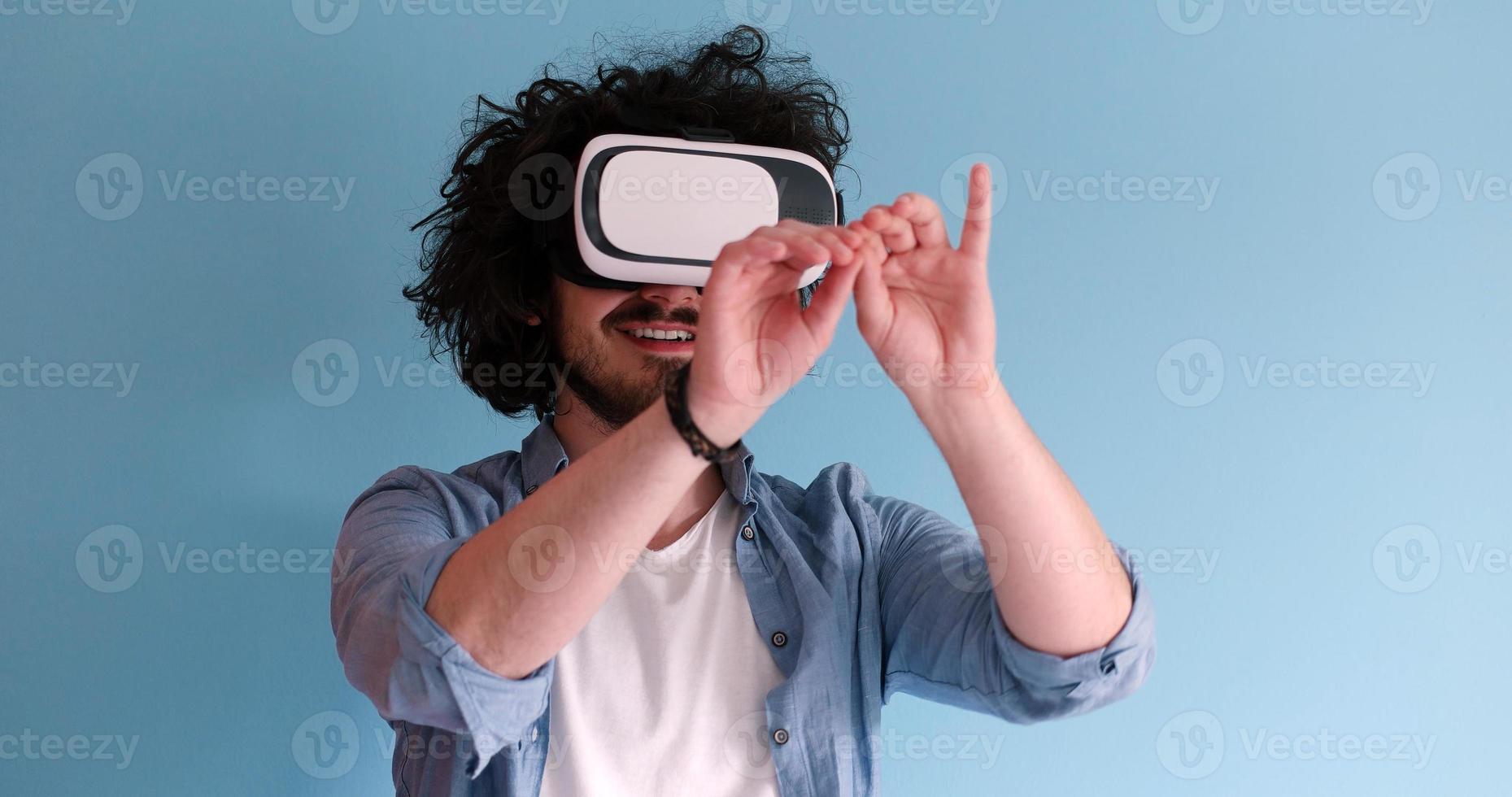 man using VR headset glasses of virtual reality photo