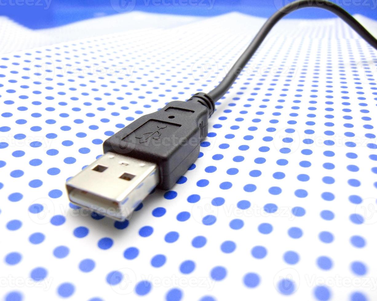 USB cable on dotted background photo