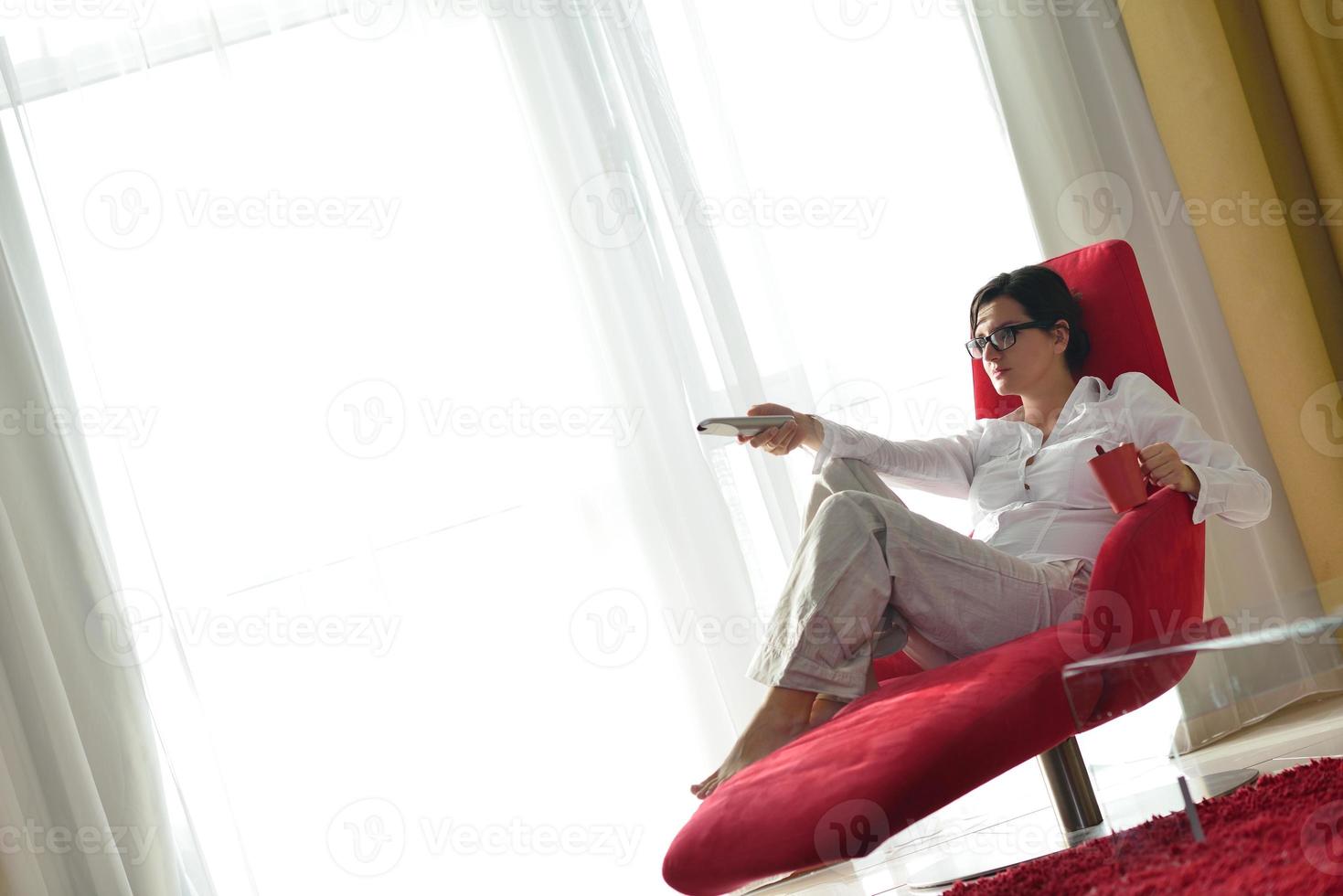 happy young woman relax at home on sofa photo