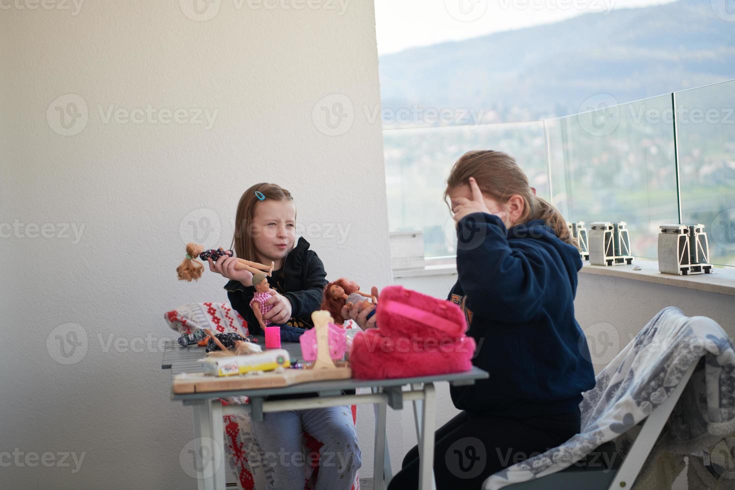 little girls playing with dolls photo