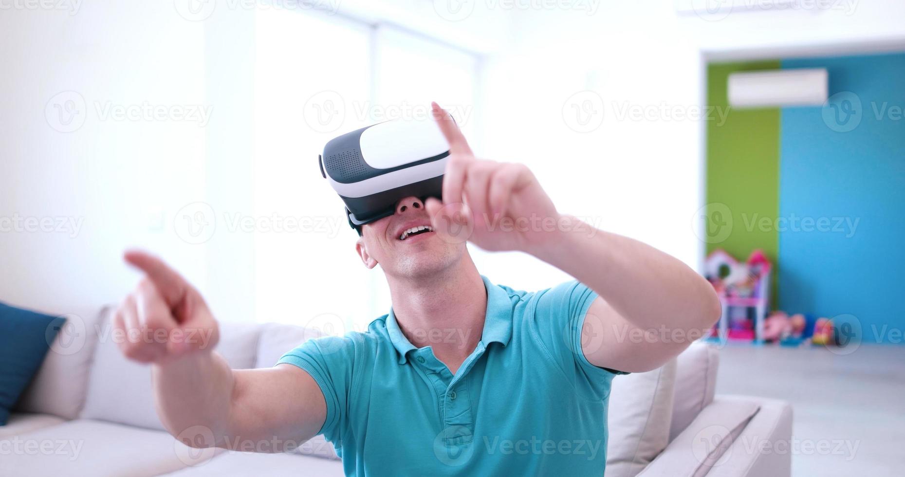man using VR-headset glasses of virtual reality photo