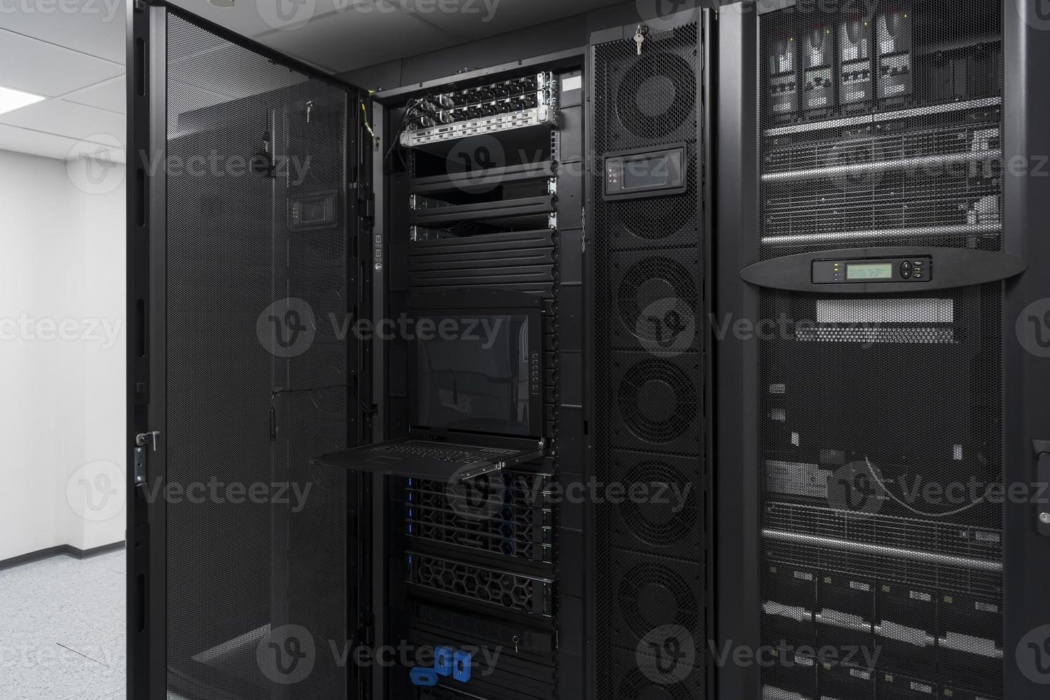 Data Center With Multiple Rows of Fully Operational Server Racks. Modern Telecommunications, Cloud Computing, Artificial Intelligence, Database, Supercomputer Technology Concept. photo