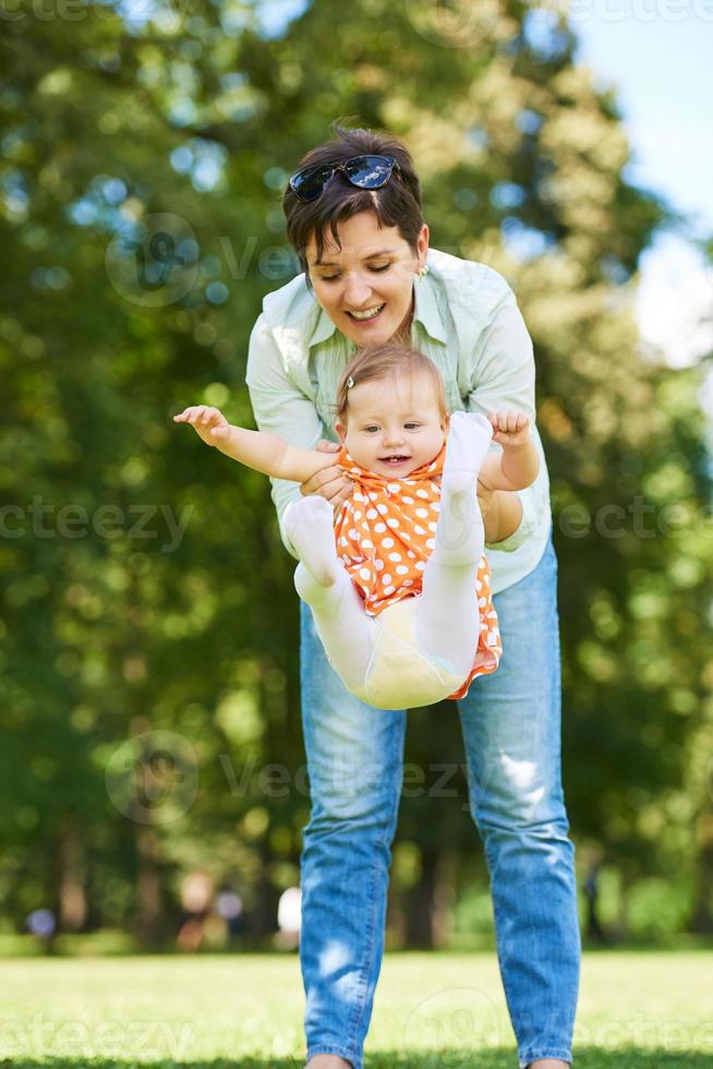 mother and baby in park photo