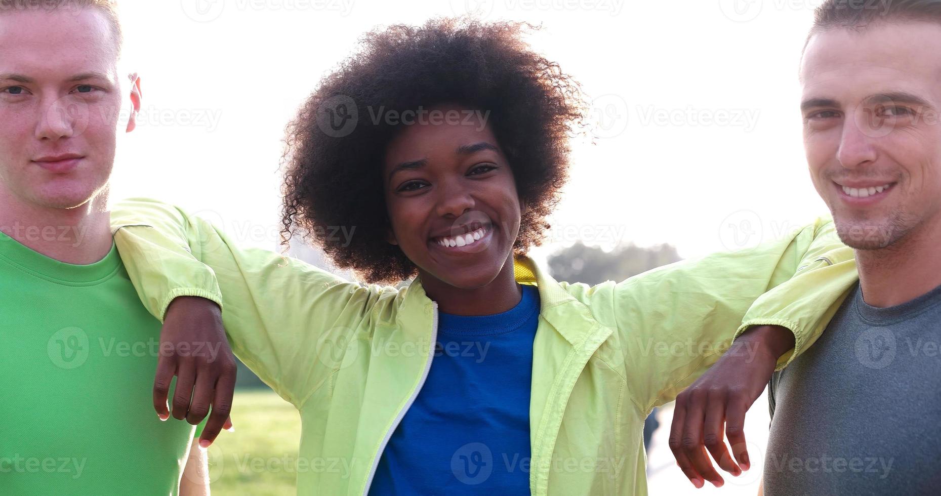 Portrait of multiethnic group of young people on the jogging photo