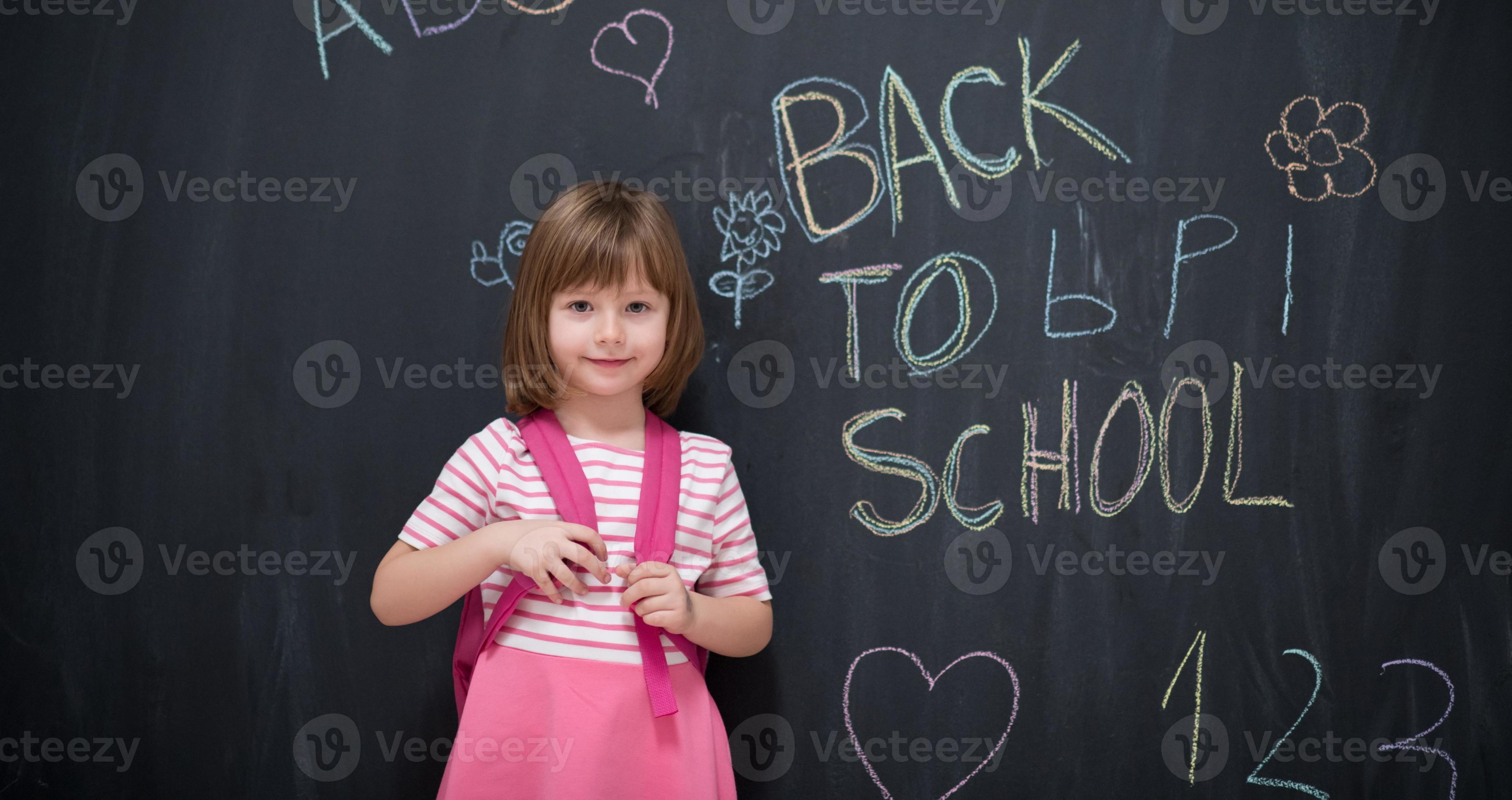 school girl child with backpack writing chalkboard 11321711 Stock Photo