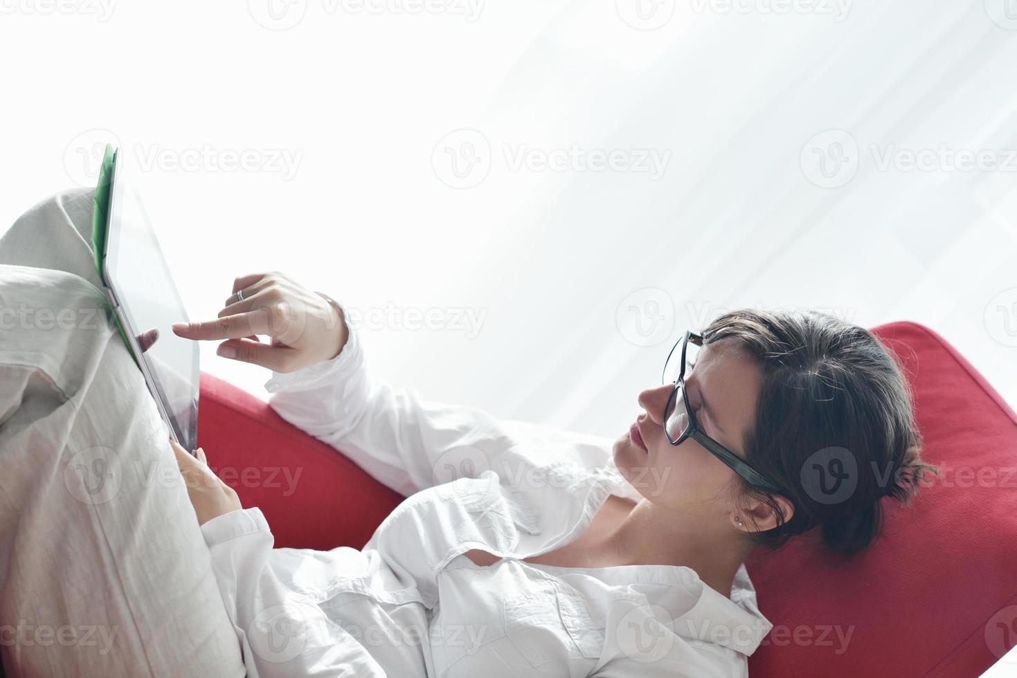 woman using tablet pc at home photo