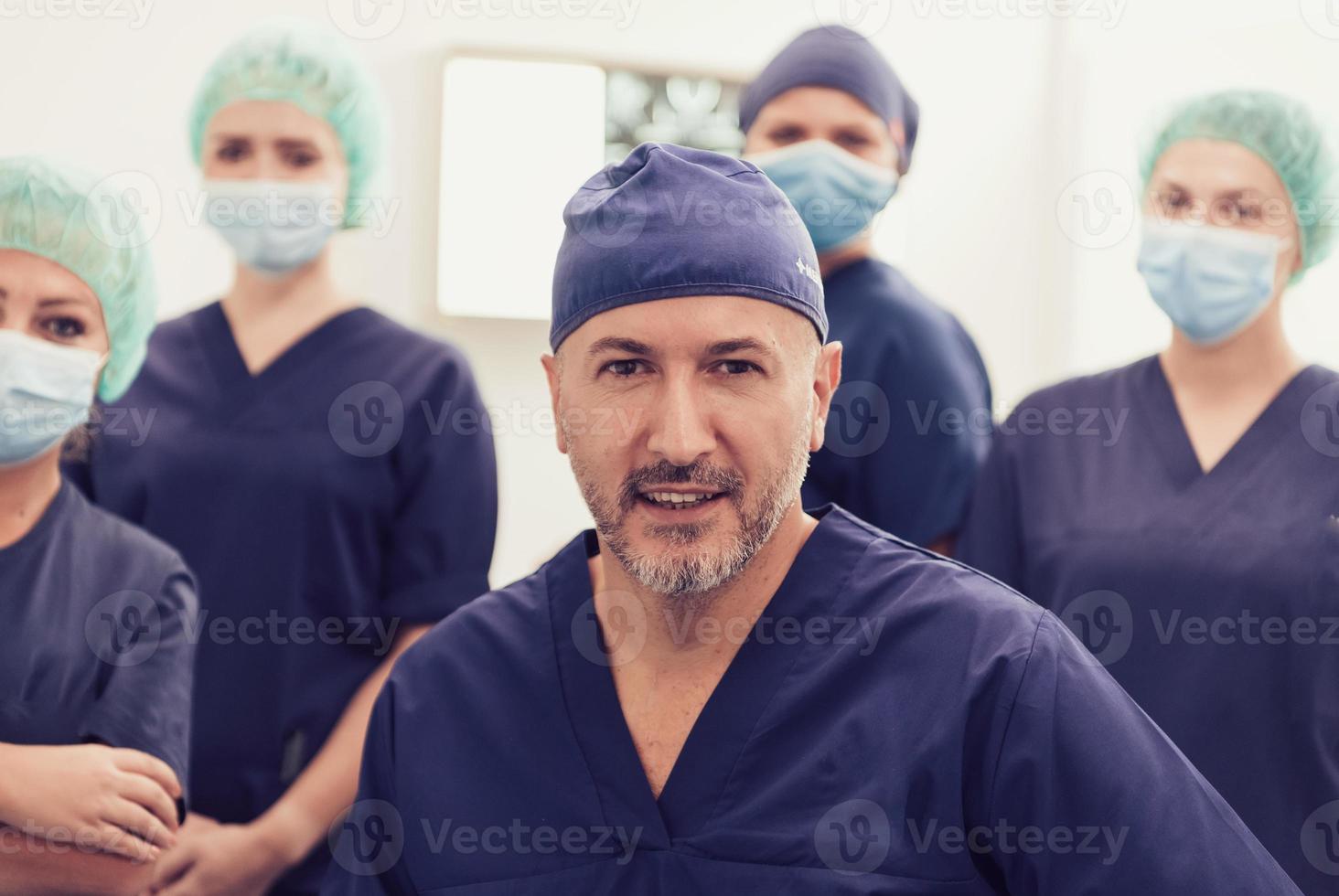 orthopedic doctor working together with his multiethnic team photo