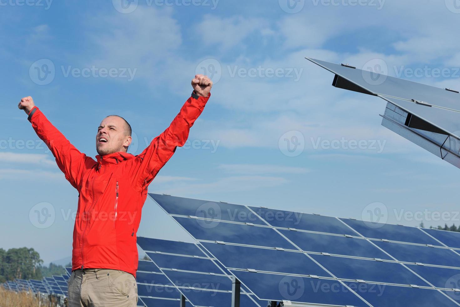 Male solar panel engineer at work place photo