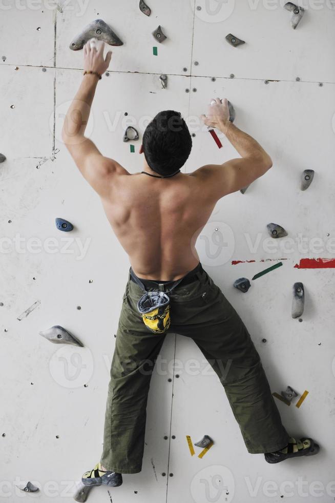 Man rock climbing photo