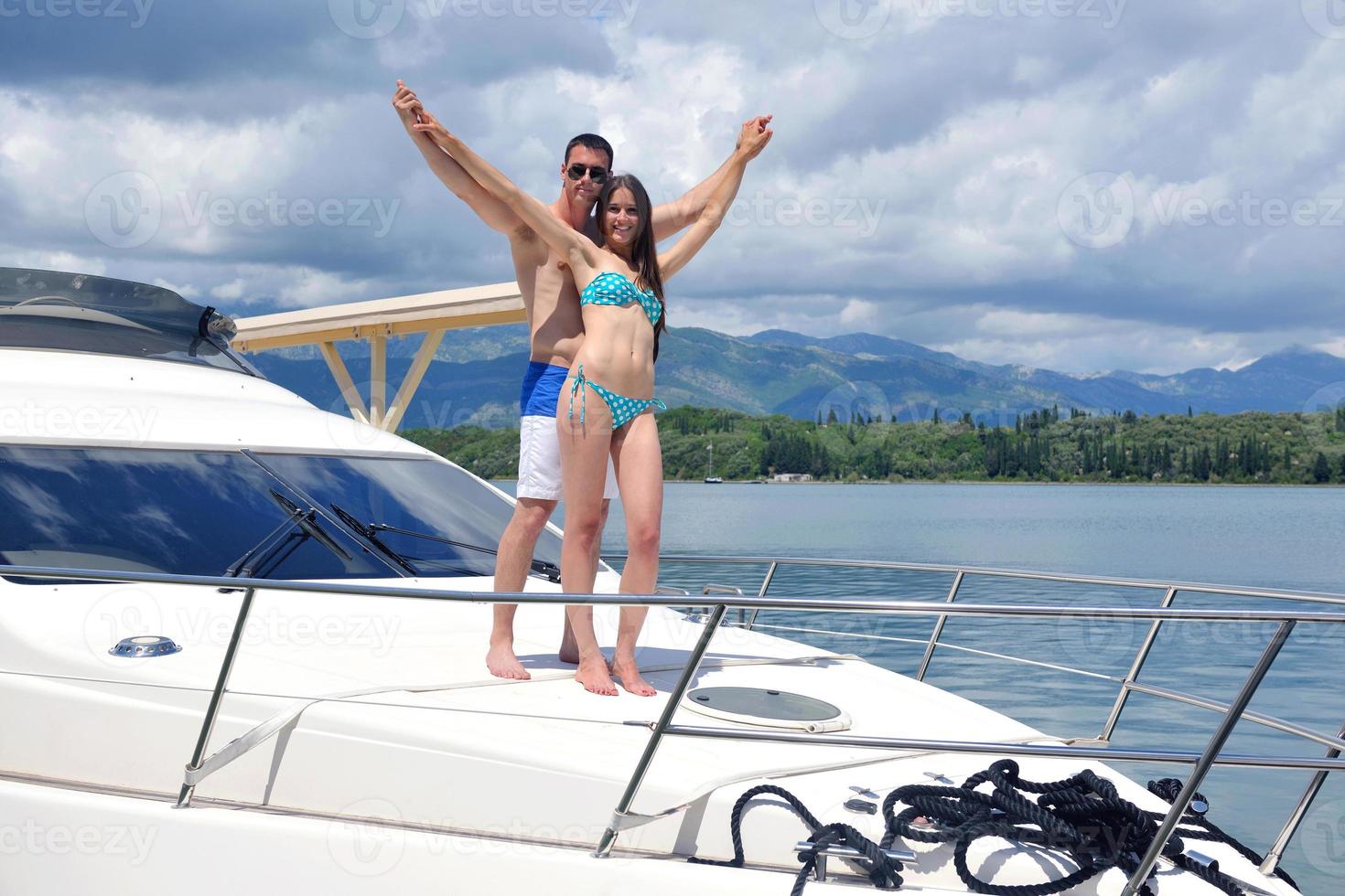 young couple on yacht photo