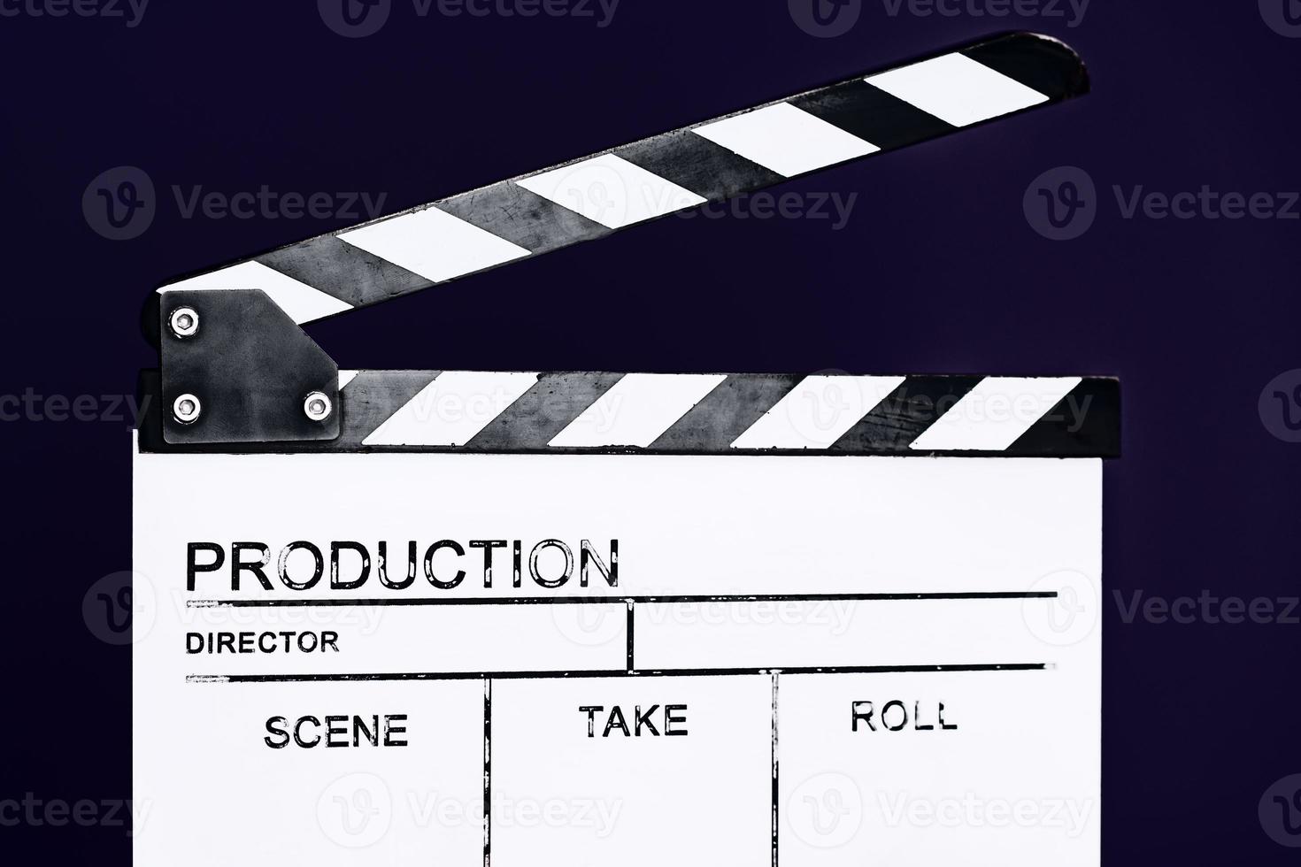 movie clapper on purple violet background photo