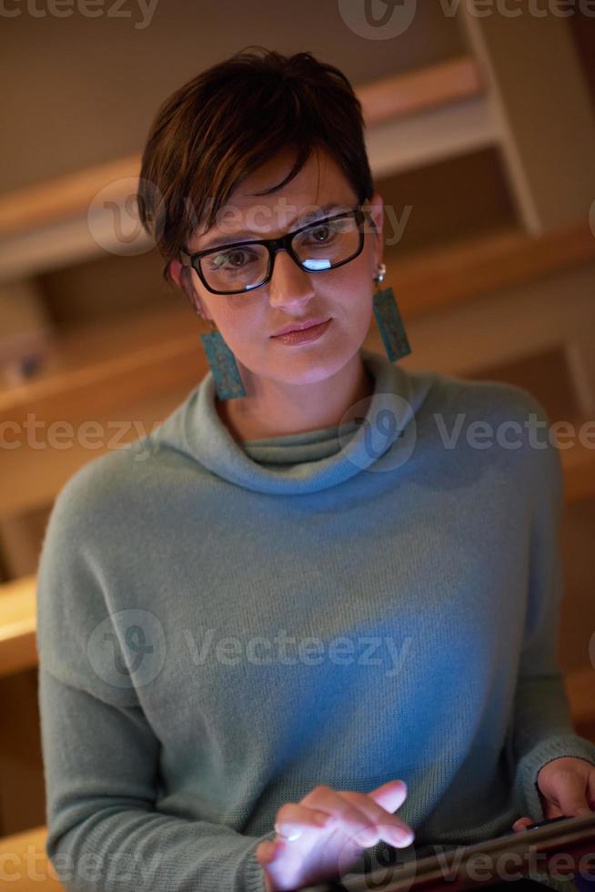 woman at home using tablet photo