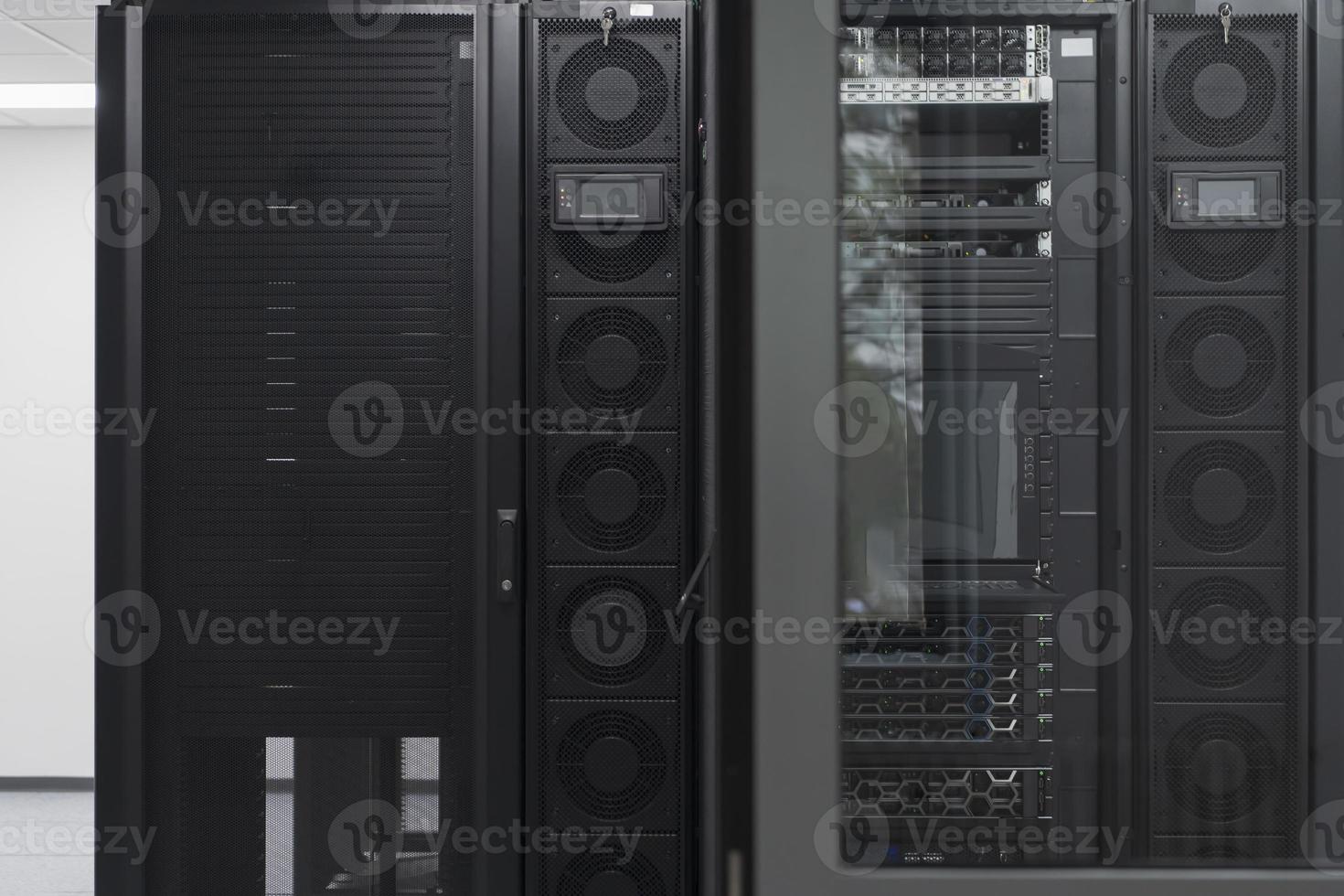 Data Center With Multiple Rows of Fully Operational Server Racks. Modern Telecommunications, Cloud Computing, Artificial Intelligence, Database, Supercomputer Technology Concept. photo