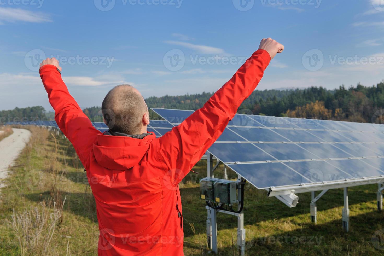 Male solar panel engineer at work place photo