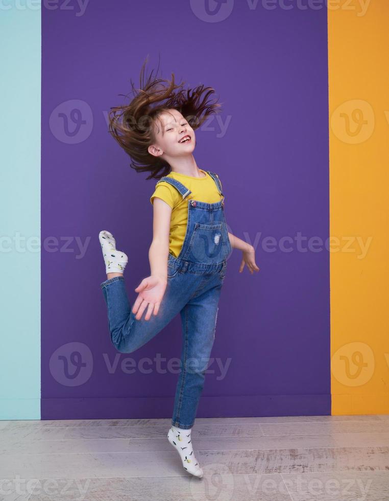 Cute little girl dancing at home photo