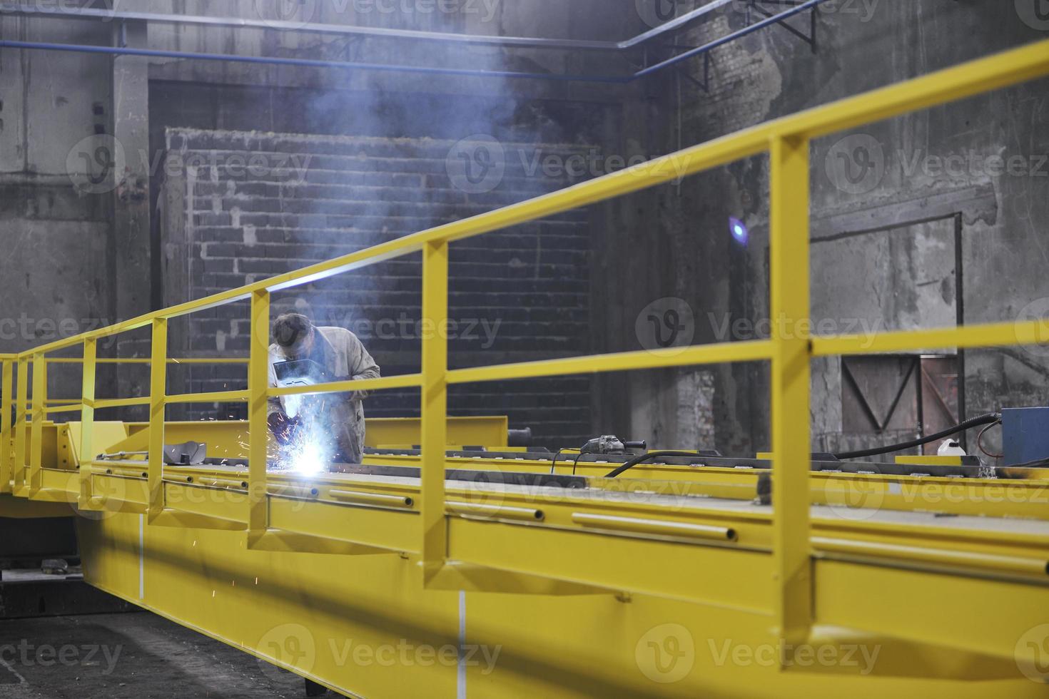 welder working indoors photo