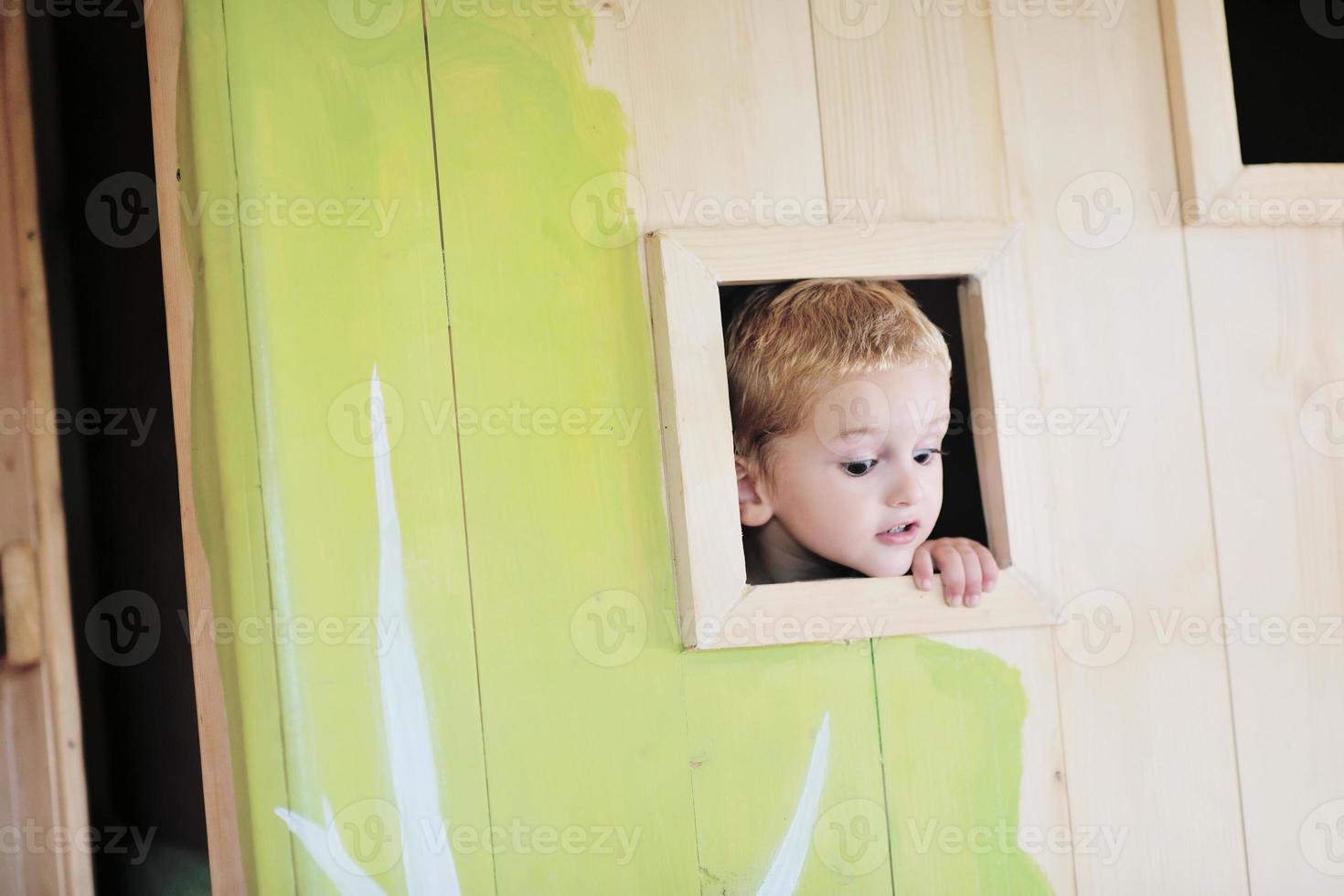 happy child in a window photo