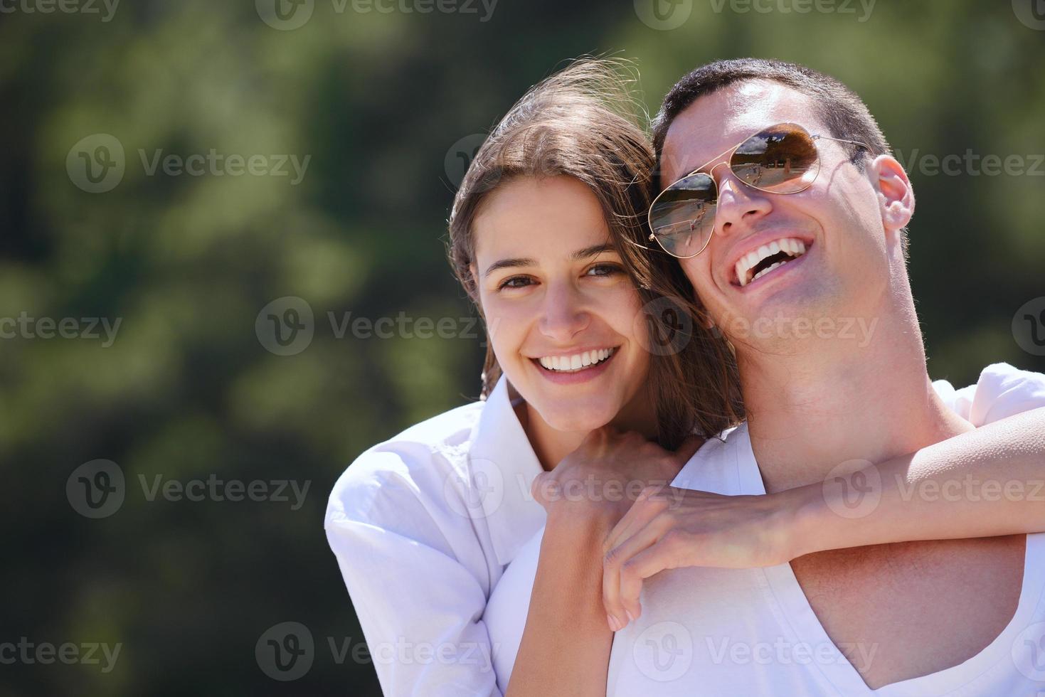 happy couple have fun on the beach photo