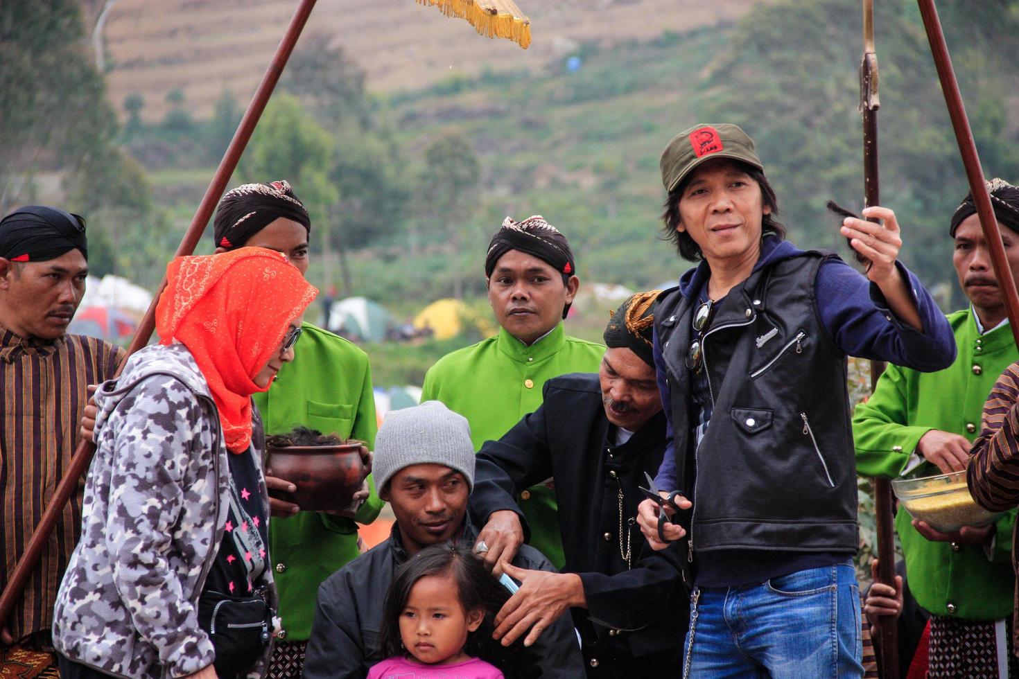 Dieng, Indonesia - August 1, 2015. Dieng Culture Festival, Tourists follow the dreadlocks procession during the Dieng Culture Festival event at Dieng, Banjarnegara district, Central Java photo