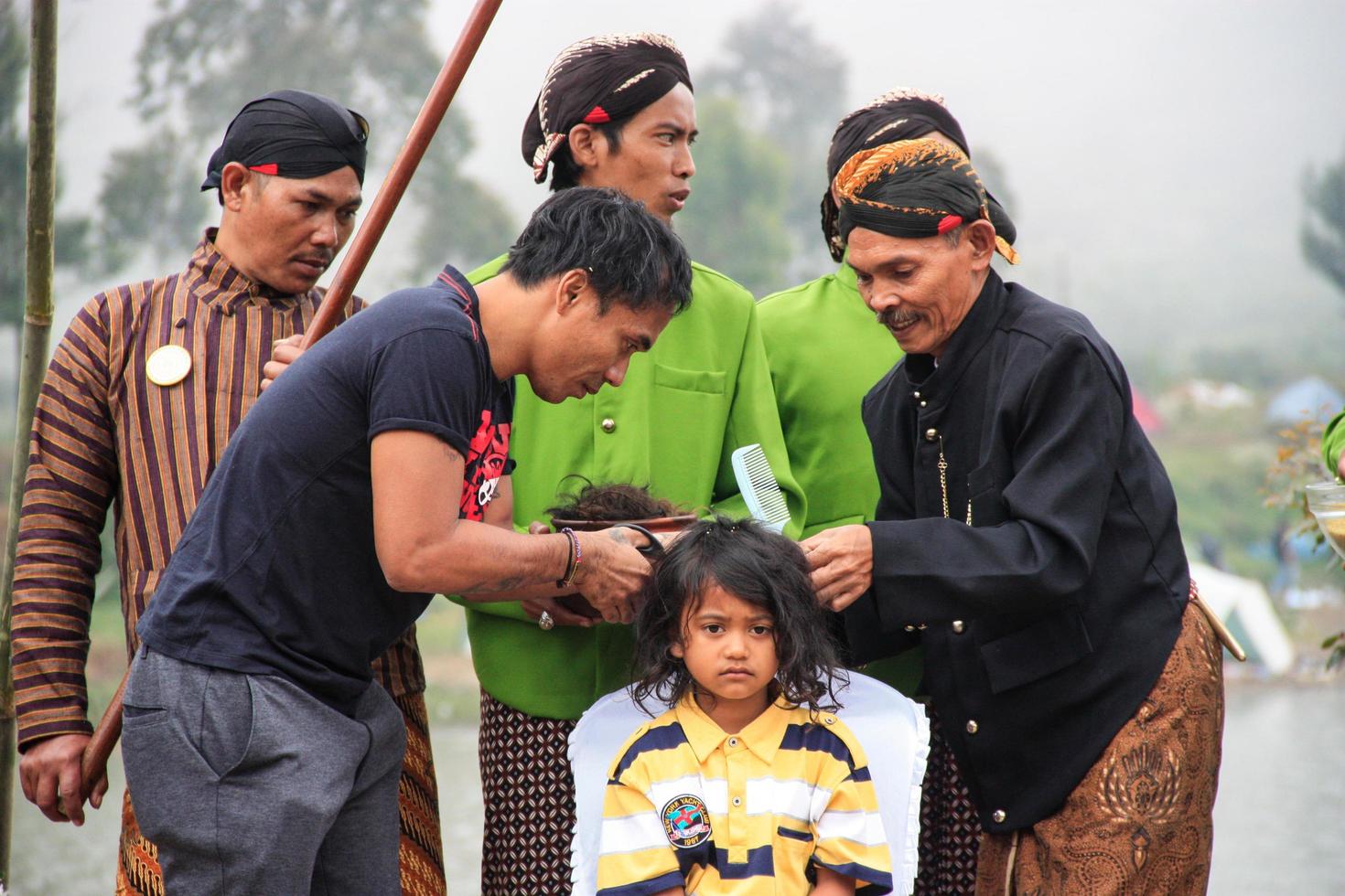 Dieng, Indonesia - August 1, 2015. Dieng Culture Festival, Tourists follow the dreadlocks procession during the Dieng Culture Festival event at Dieng, Banjarnegara district, Central Java photo