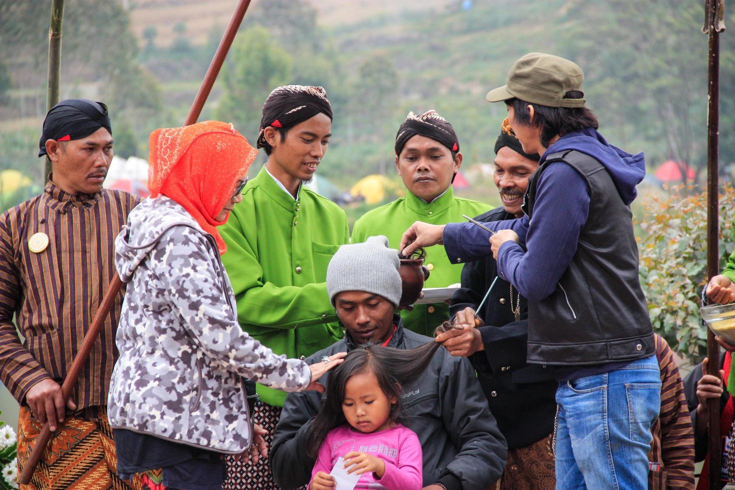Dieng, Indonesia - August 1, 2015. Dieng Culture Festival, Tourists follow the dreadlocks procession during the Dieng Culture Festival event at Dieng, Banjarnegara district, Central Java photo