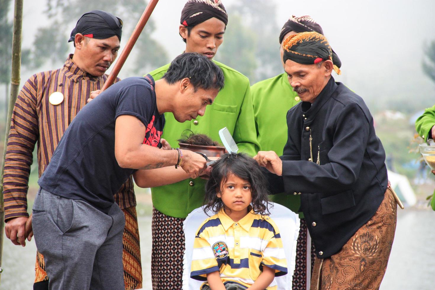 Dieng, Indonesia - August 1, 2015. Dieng Culture Festival, Tourists follow the dreadlocks procession during the Dieng Culture Festival event at Dieng, Banjarnegara district, Central Java photo