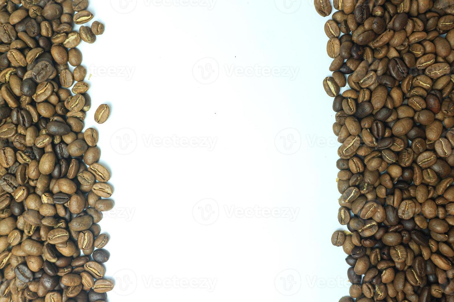 Frame of roasted coffee beans isolated on white may use as background or texture photo