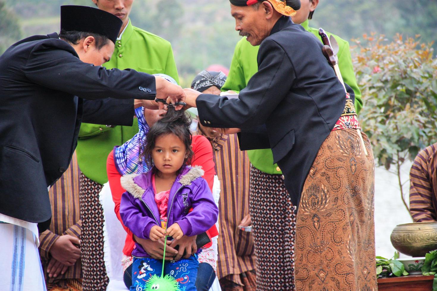Dieng, Indonesia - August 1, 2015. Dieng Culture Festival, Tourists follow the dreadlocks procession during the Dieng Culture Festival event at Dieng, Banjarnegara district, Central Java photo
