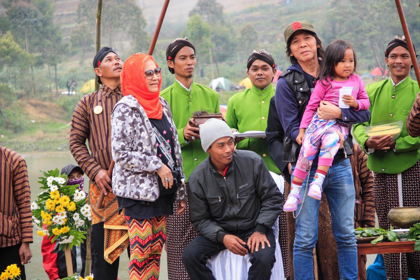 Dieng, Indonesia - August 1, 2015. Dieng Culture Festival, Tourists follow the dreadlocks procession during the Dieng Culture Festival event at Dieng, Banjarnegara district, Central Java photo