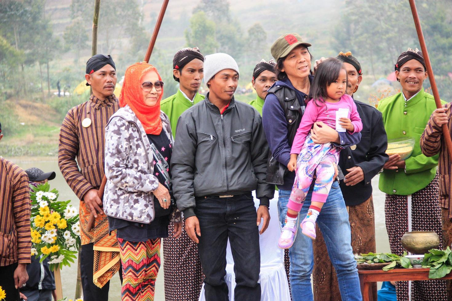 Dieng, Indonesia - August 1, 2015. Dieng Culture Festival, Tourists follow the dreadlocks procession during the Dieng Culture Festival event at Dieng, Banjarnegara district, Central Java photo