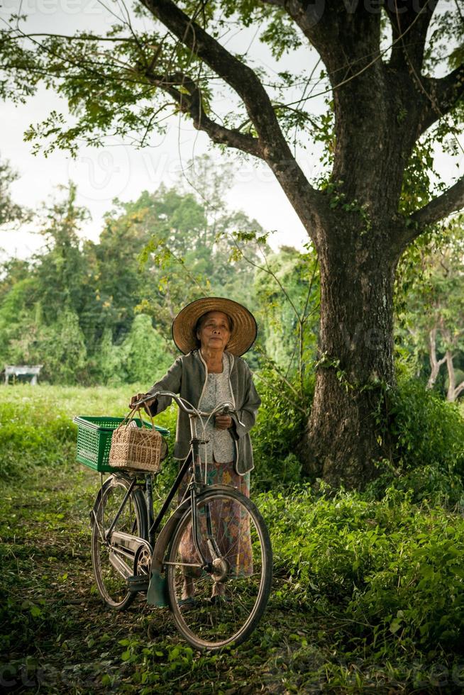 Grandmother on bikes at the country side photo