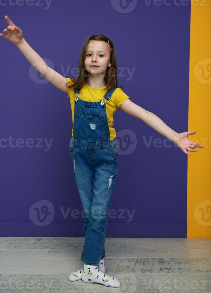Cute little girl dancing at home photo