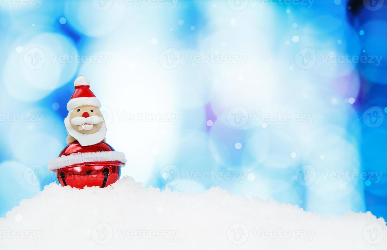 Santa Claus and christmas decoration on abstract background and snowflakes photo