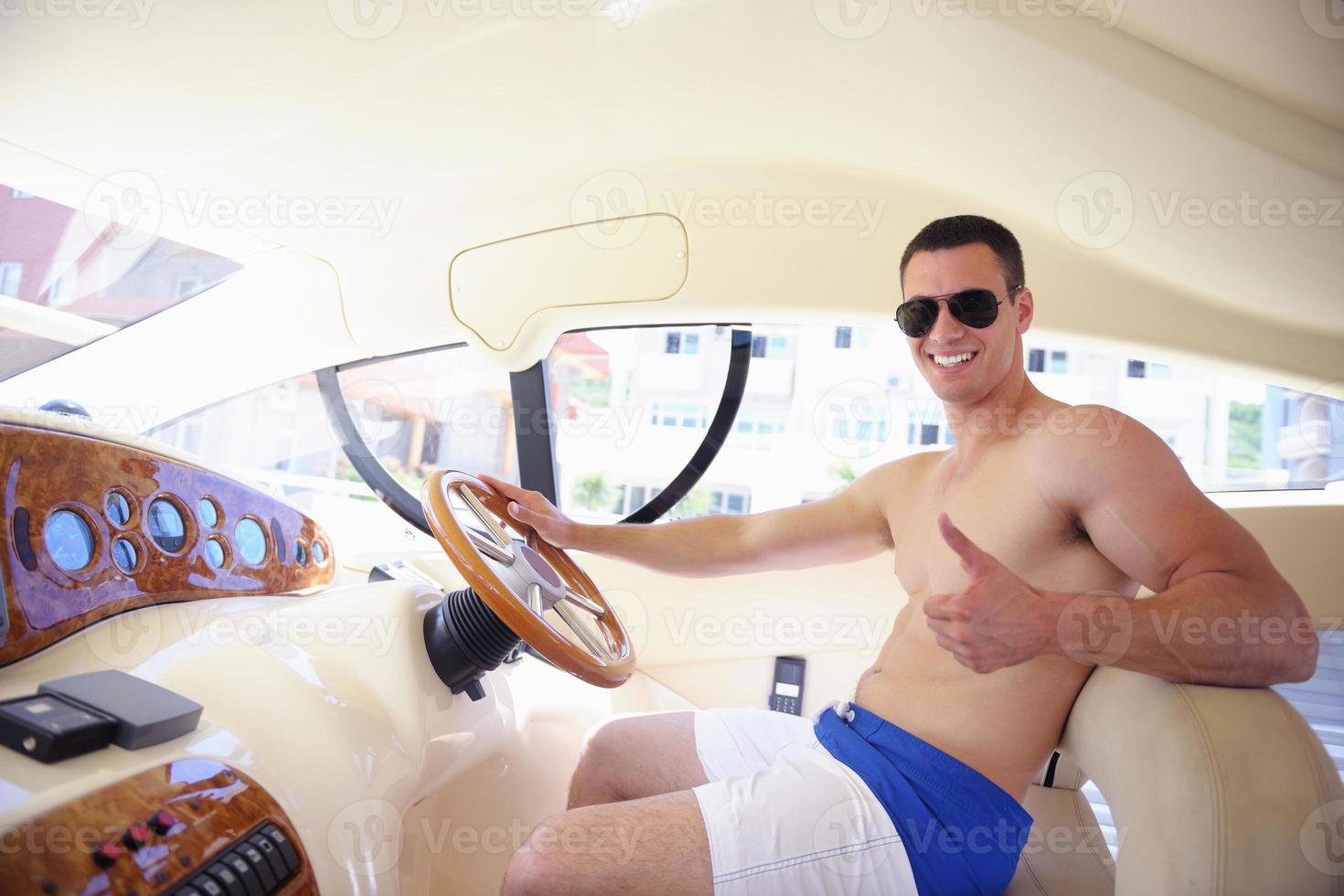 young man on yacht photo