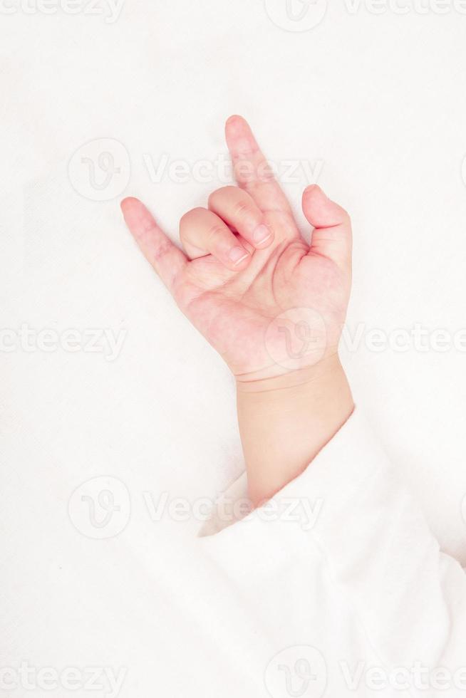 Baby hand with love symbol photo