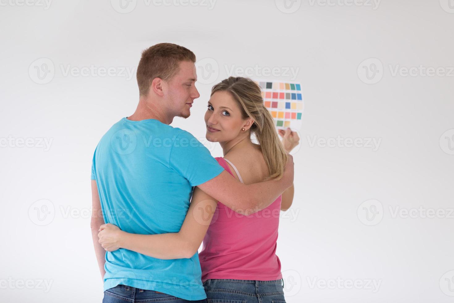 couple looking at color samples at home photo