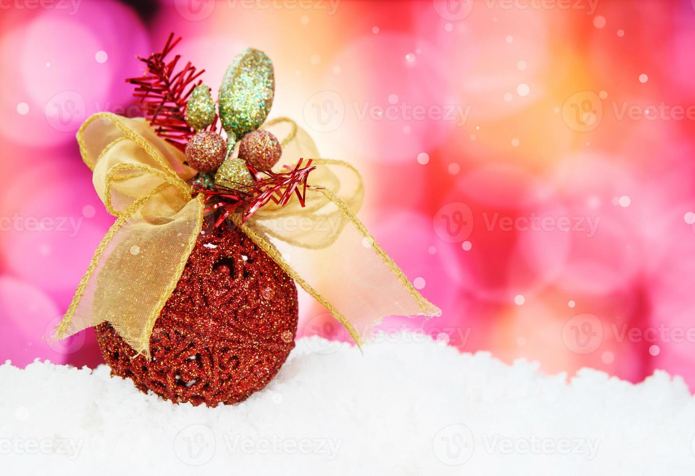 Christmas Background Made of a Red Ball and Beautiful Bokeh photo